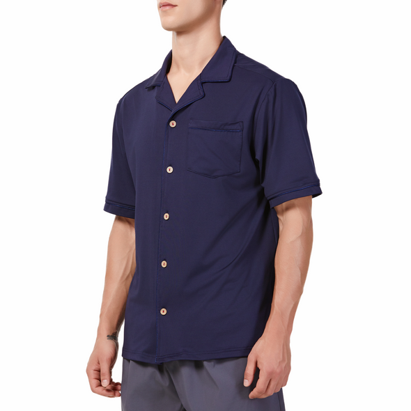 Men's Short sleeve navy camp shirt in a relaxed fit with a chest pocket made from knit fabric on a model - quarter view