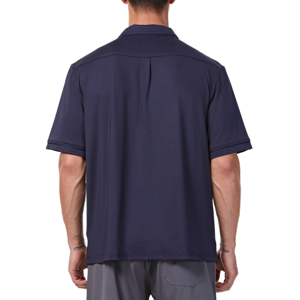Men's Short sleeve navy camp shirt in a relaxed fit with a chest pocket made from knit fabric on a model - back view