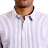 close up view of the pointed collar and neck area of soft blue and white cotton fabric button up shirt showing the vertical business pattern of the shirt. Worn by a black male model. The top buttons are undone