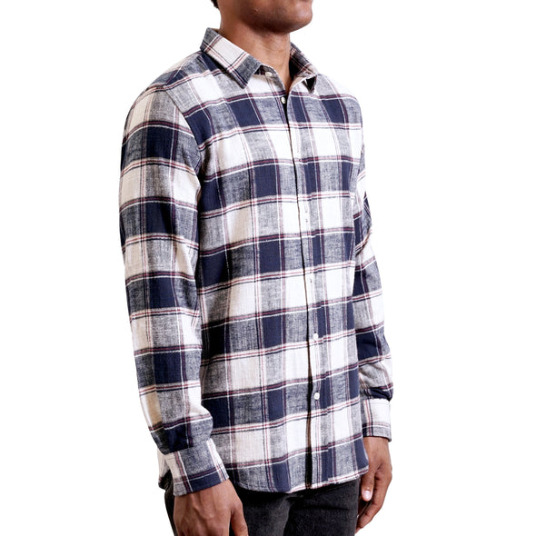 three quarters side view of men's long sleeve, tailored, blue and cream plaid flannel button up shirt on a black model.