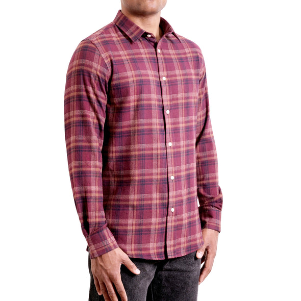 three quarters side view of men's long sleeve, slim fit,  maroon plaid flannel button up shirt on a black model