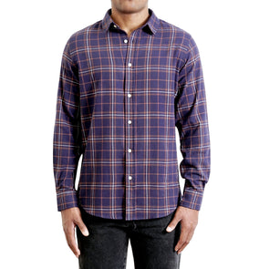 Men's timeless navy and red accented plaid flannel button up shirt long sleeve on a black model - front view