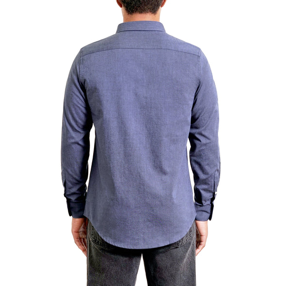 Back view of a men's long sleeve, button up woven organic cotton in navy blue color. Worn by a black male model