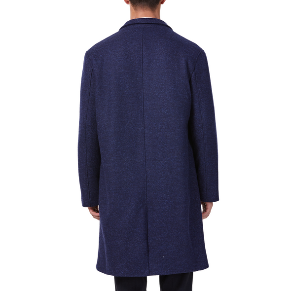 Men's long sleeve navy wool blend overcoat with 2 buttons at the front closer, large welt waist pockets and slightly oversized on a model - back view
