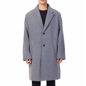 Men's long sleeve grey wool blend overcoat with 2 buttons at the front closer, large welt waist pockets and slightly oversized on a model - front view