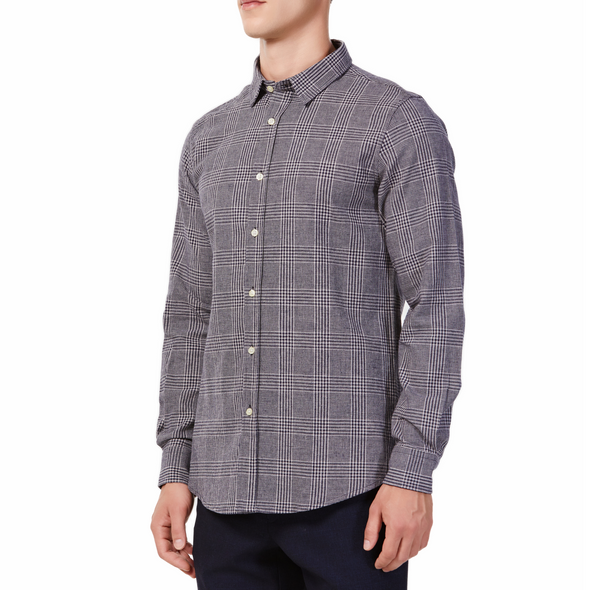 Men's black and white plaid patterned, long sleeve button up shirt with a pointed collar on a model. Image is cropped to the torso and model is angled to the models right
