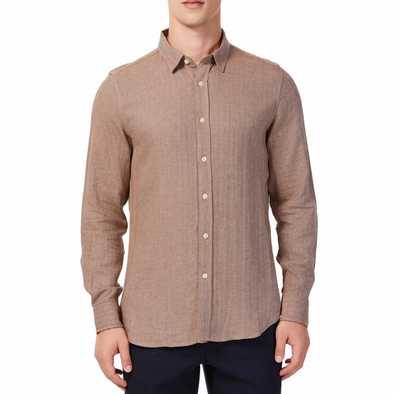 Men's brown linen long sleeve button up shirt with a pointed collar on a model. Image is cropped to the torso and model is facing straight forward
