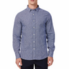 Men's navy and white mini houndstooth patterned linen blend fabric, long sleeve button up shirt with a pointed collar on a model. Image is cropped to the torso and model is facing straight forward