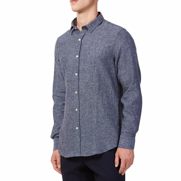 Men's textured flecked black linen long sleeve button up shirt with a pointed collar on a model. Image is cropped to the torso and model is angled to the models right