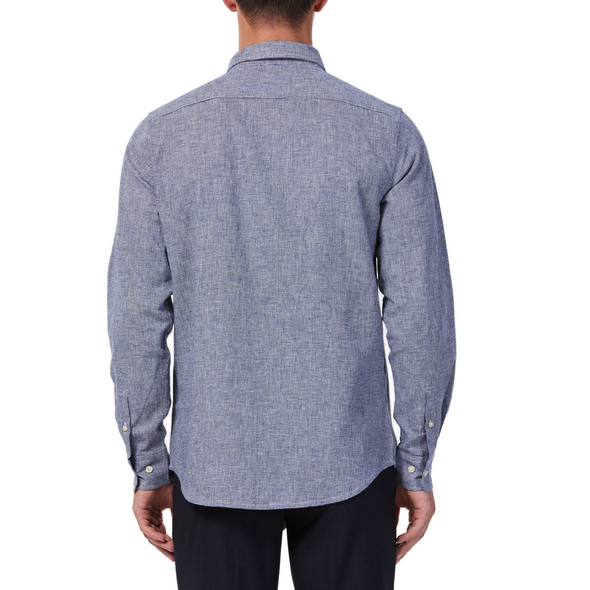 Men's  navy and white mini houndstooth patterned linen blend,  long sleeve button up shirt with a pointed collar on a model. Image is cropped to the torso and a back view of the shirt
