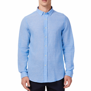 Men's bright blue linen long sleeve button up shirt with a pointed collar on a model. Image is cropped to the torso and model is facing straight forward