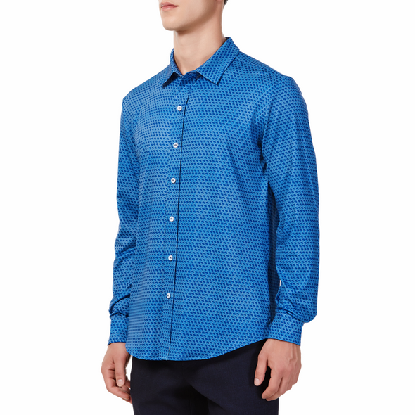 Men's blue button up shirt with a dark blue honeycomb pattern all over, has long sleeves, button up front and pointed collar. made from knit fabric on a model - quarter turn view