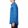 Men's blue button up shirt with a dark blue honeycomb pattern all over, has long sleeves, button up front and pointed collar. made from knit fabric on a model - side view