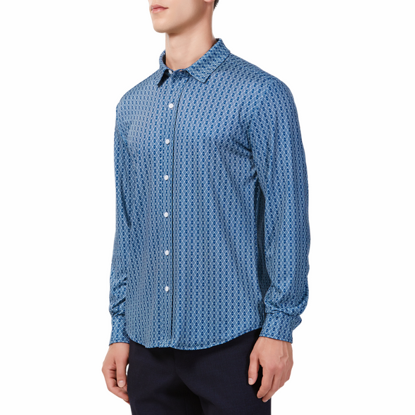 Men's blue diamond geometric print button up shirt long sleeve made from knit fabric on a model - side view