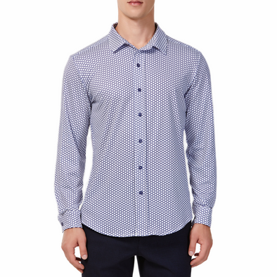 Men's white button up shirt with a navy honeycomb pattern all over, has long sleeves, button up front and pointed collar. made from knit fabric on a model - front view