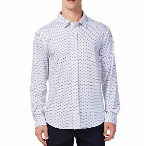 Men's white button up shirt with a dark blue dotted pattern all over, has long sleeves, button up front and pointed collar. made from knit fabric on a model - front view