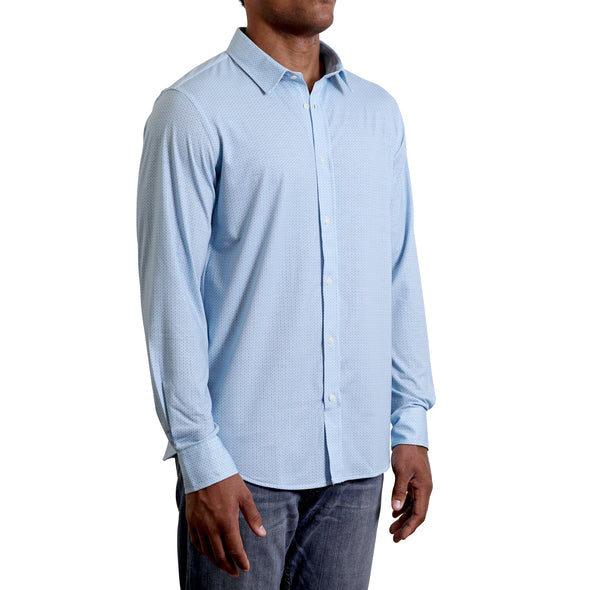 three quarters side view of men's long sleeve, slim fit, light blue ground with a small dot print on a knit fabric button up shirt on a black model