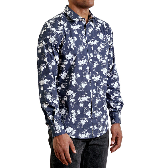 three quarters side view of men's long sleeve, slim fit, contemporary floral print button up shirt on a black model. Print is white on a navy ground and shirt is a smooth cotton fabric