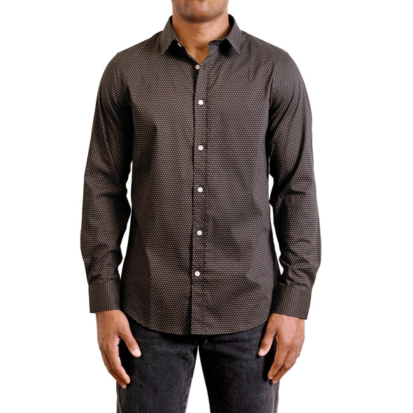 A classic small detail print on a black ground featured on this button up shirt long sleeve made from crisp cotton fabric on a black male model - front view