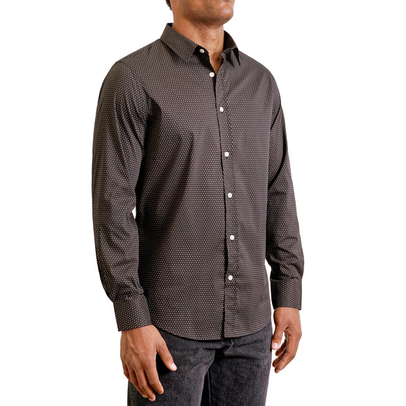 three quarters side view of men's long sleeve, slim fit, timeless small geometric print button up shirt on a black model. Print is warm toned tan and white on a black ground cotton fabric